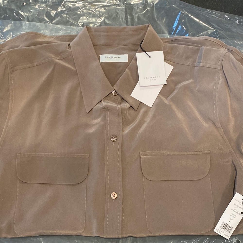 Brand New Equipment 100% silk blouse. Never worn and too late to return.